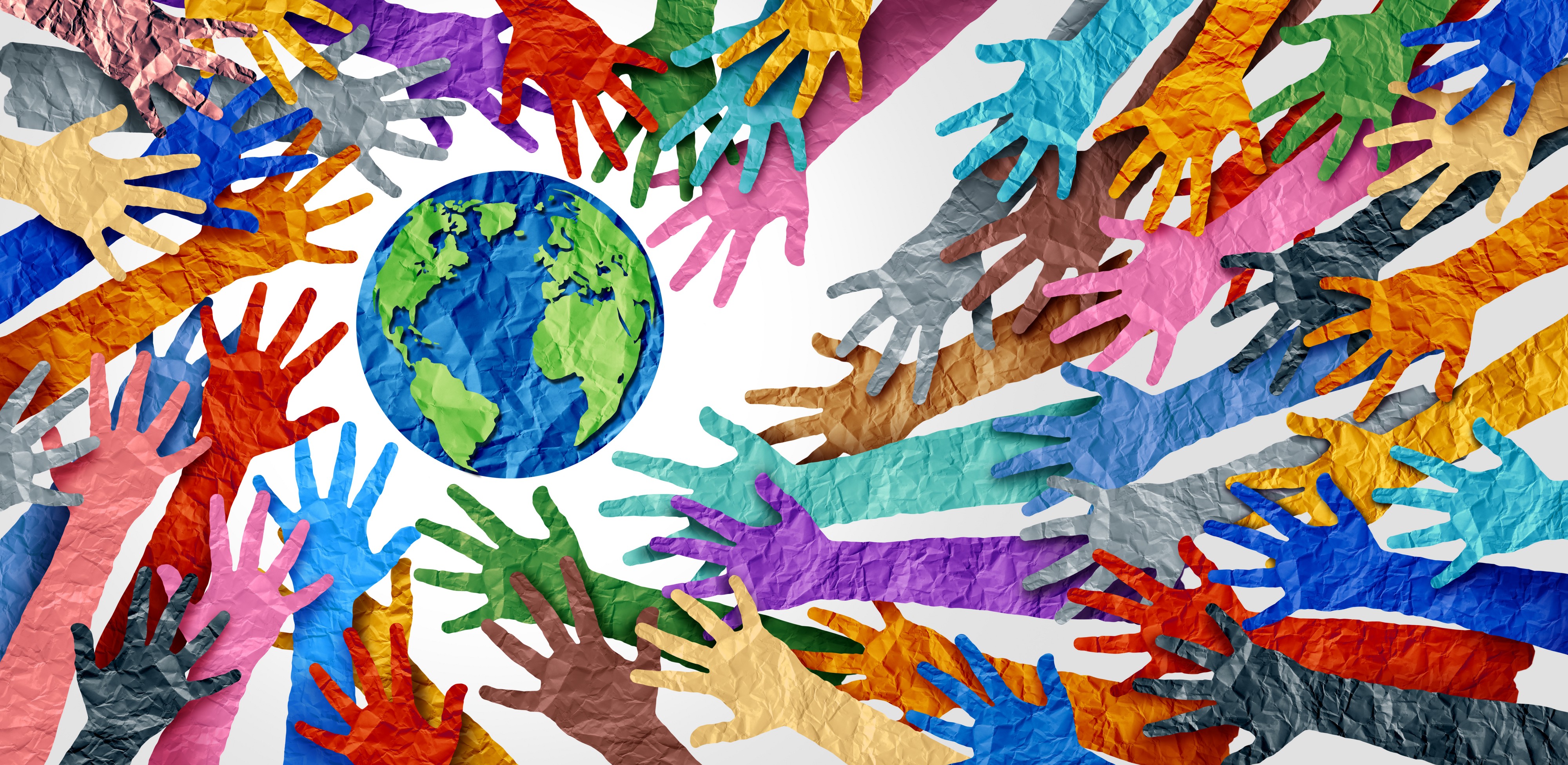 multi-colored cut out crumpled paper hands reaching towards a graphic of the earth which is also made with crumpled then smoothed out paper. Blue earth with green continents.